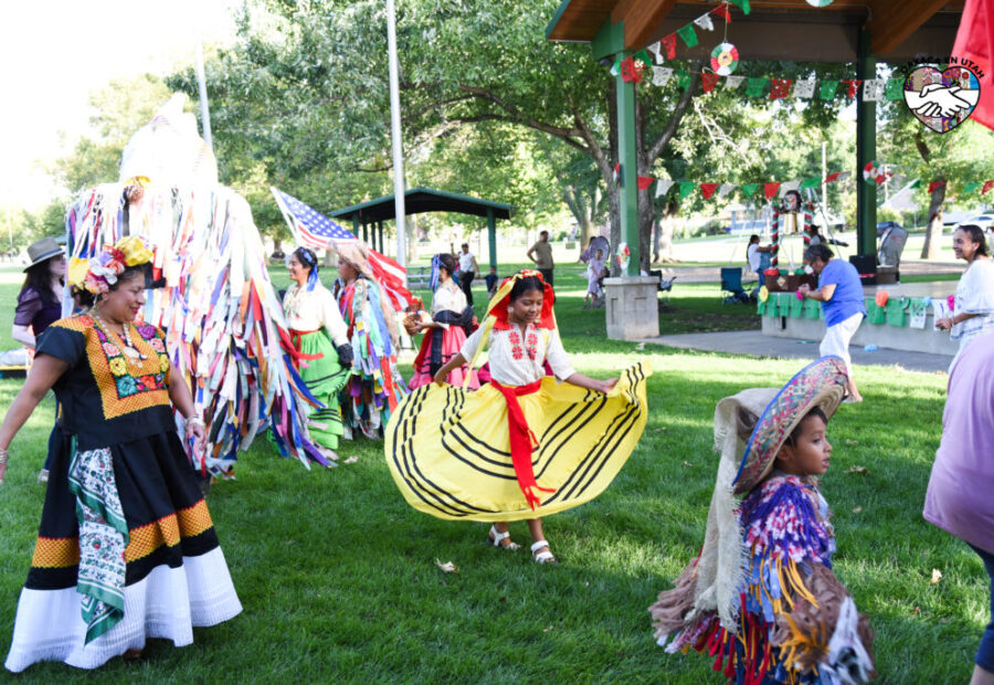 Oaxaca en Utah community members dancing together at Heritage Park